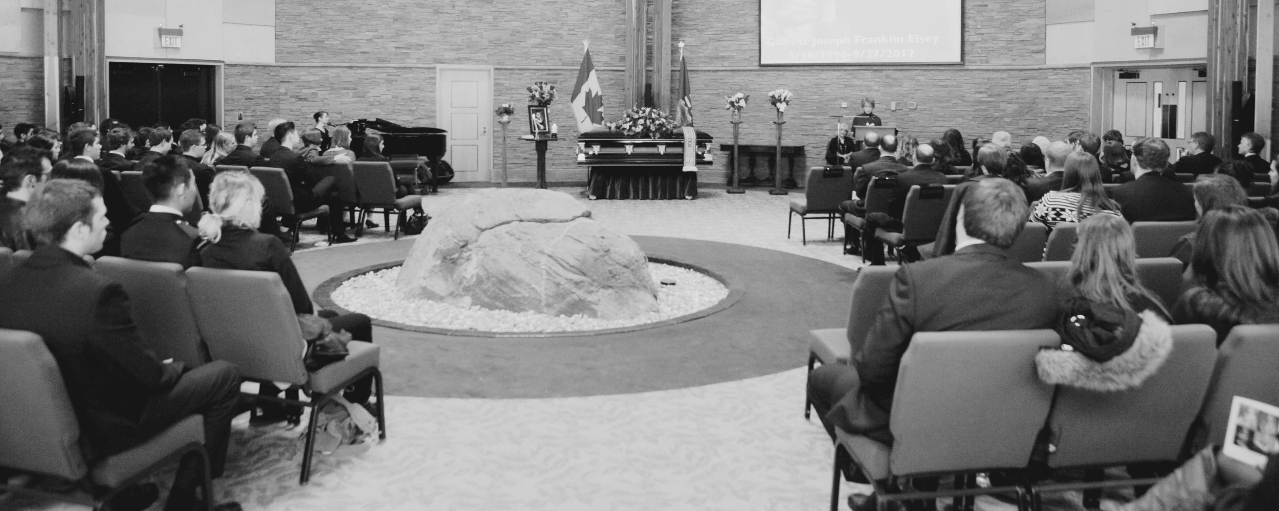 A wide view of a grand piano setup for a professional musical tribute at Beechwood Cemetery.