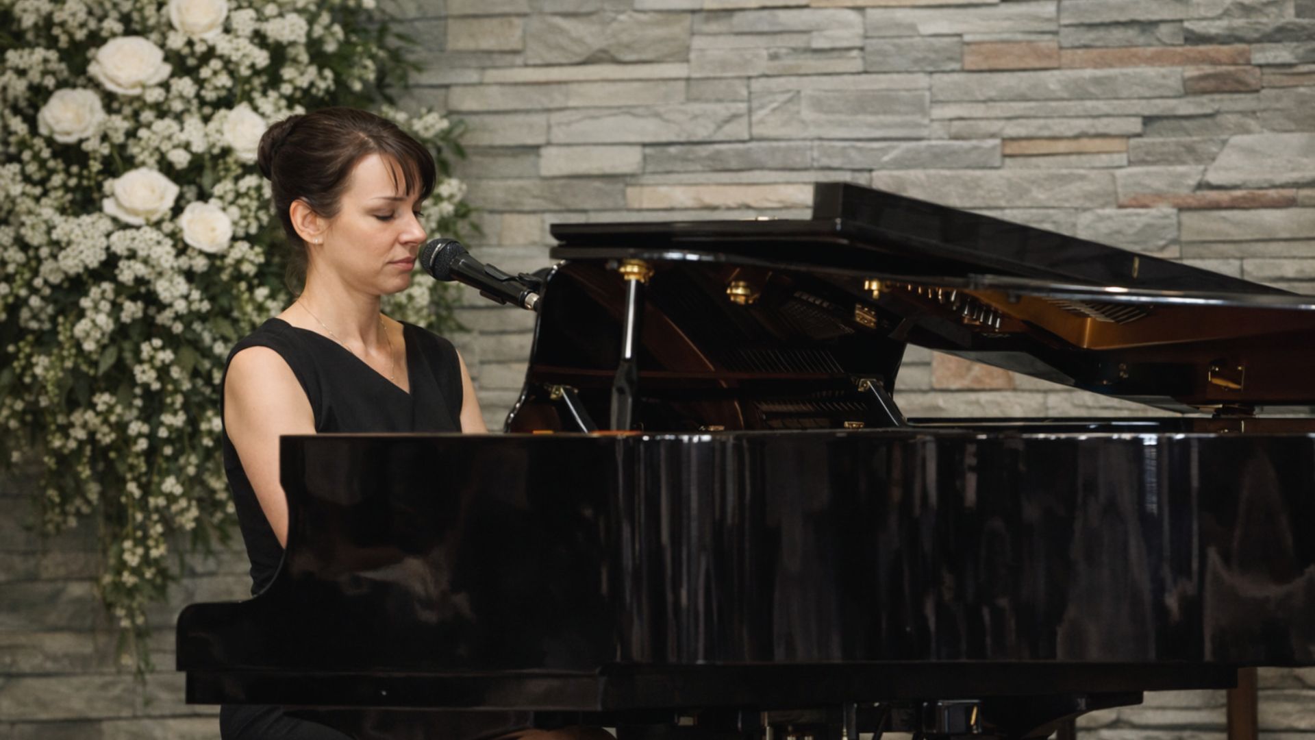 Live music at grand piano for a funeral service in the Sacred Space at Beechwood Cemetery.
