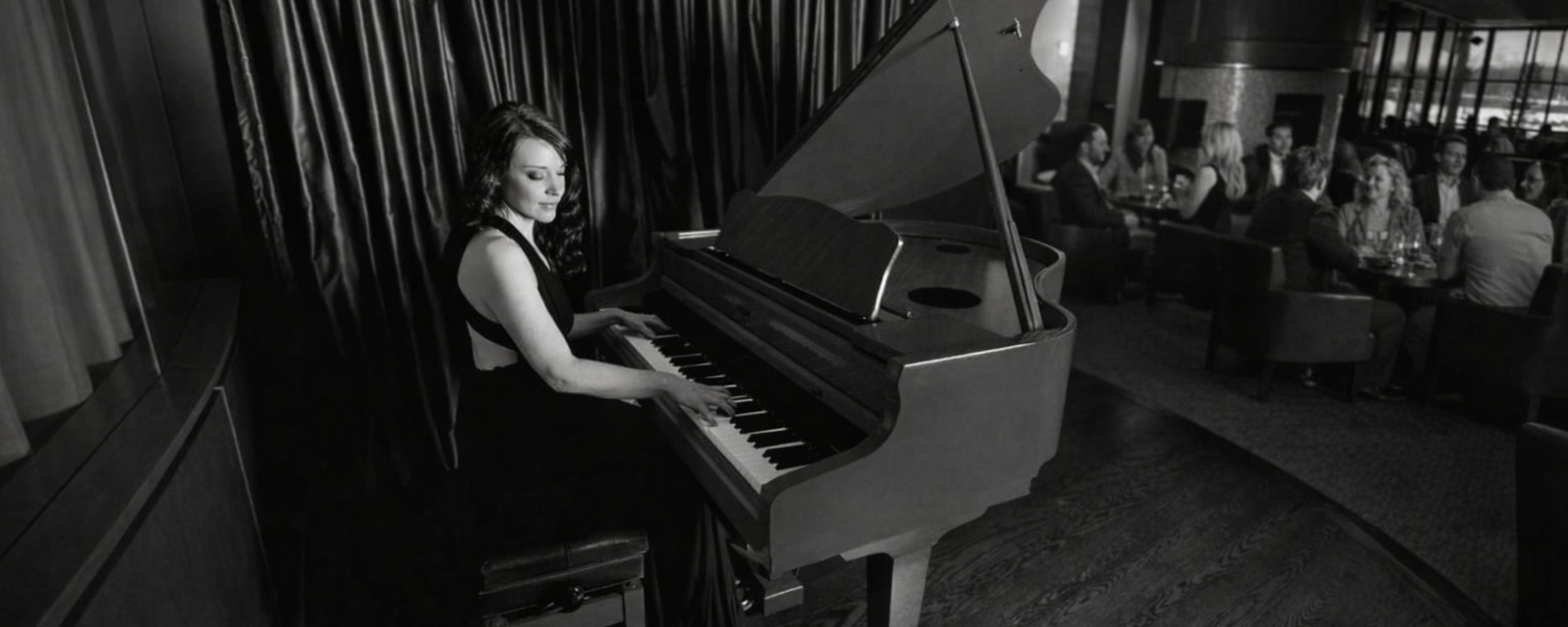 Live music performance by Kimberley Dunn at the Brookstreet Hotel Options Lounge, creating an elegant atmosphere for guests.