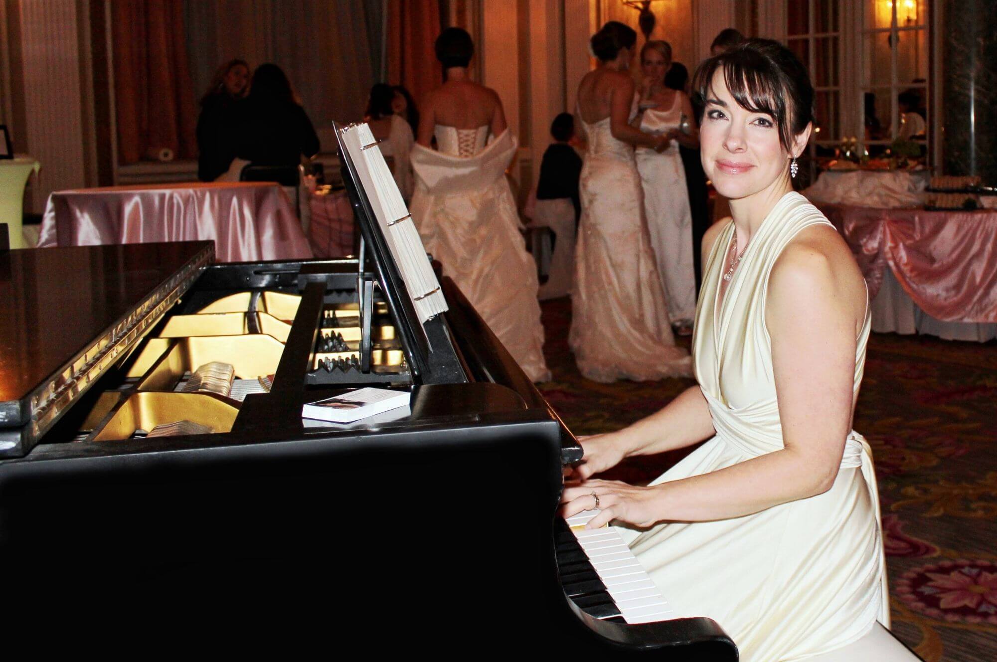 Kimberley Dunn performing at piano in Chateau Laurier Ballroom
