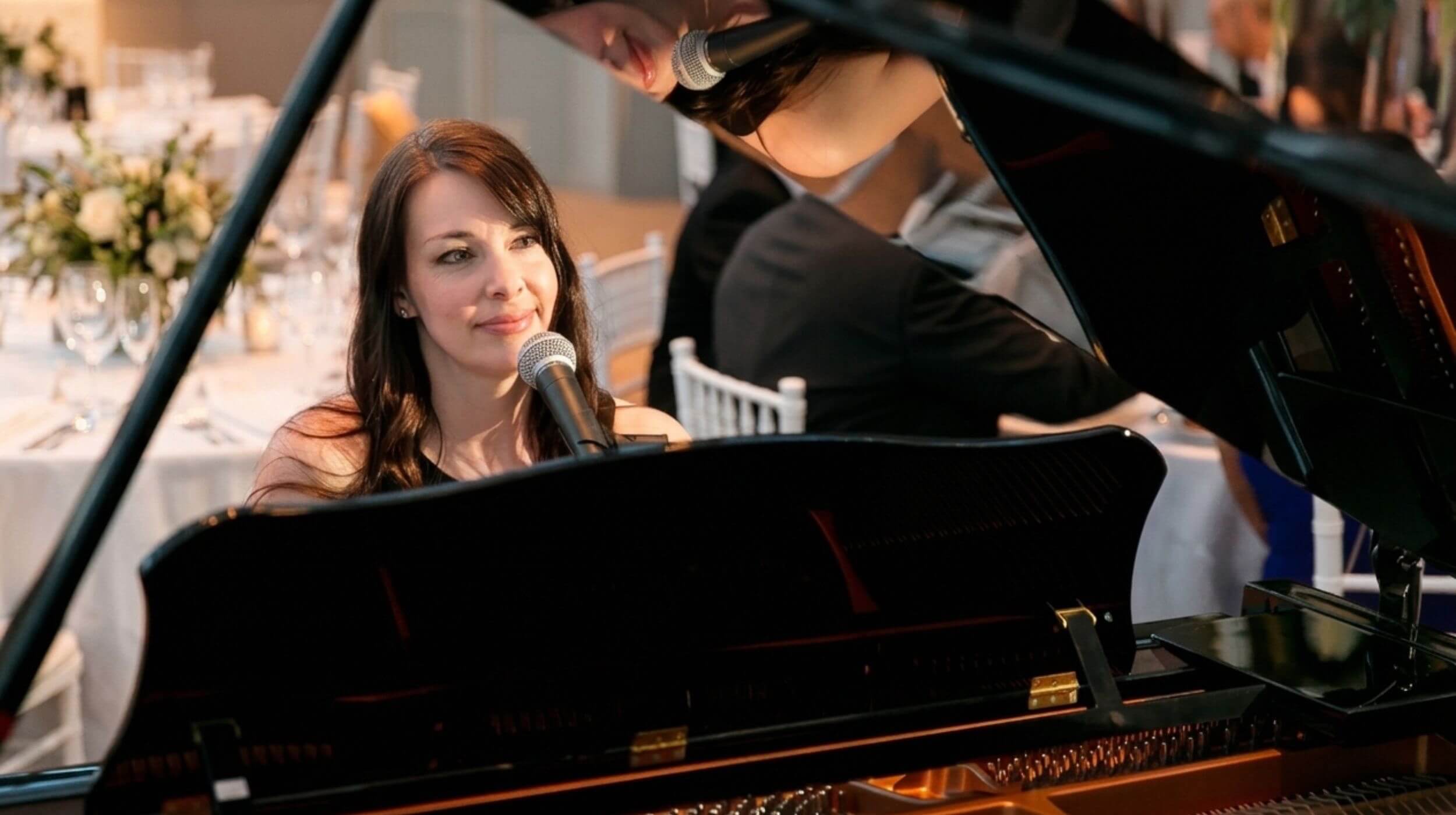 Kimberley Dunn performing on a grand piano for a wedding at the National Gallery of Canada.