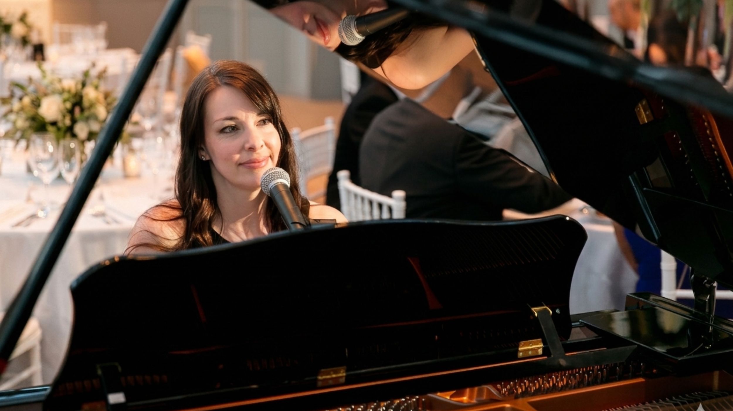 Kimberley Dunn performing on a grand piano for a wedding at the National Gallery of Canada.