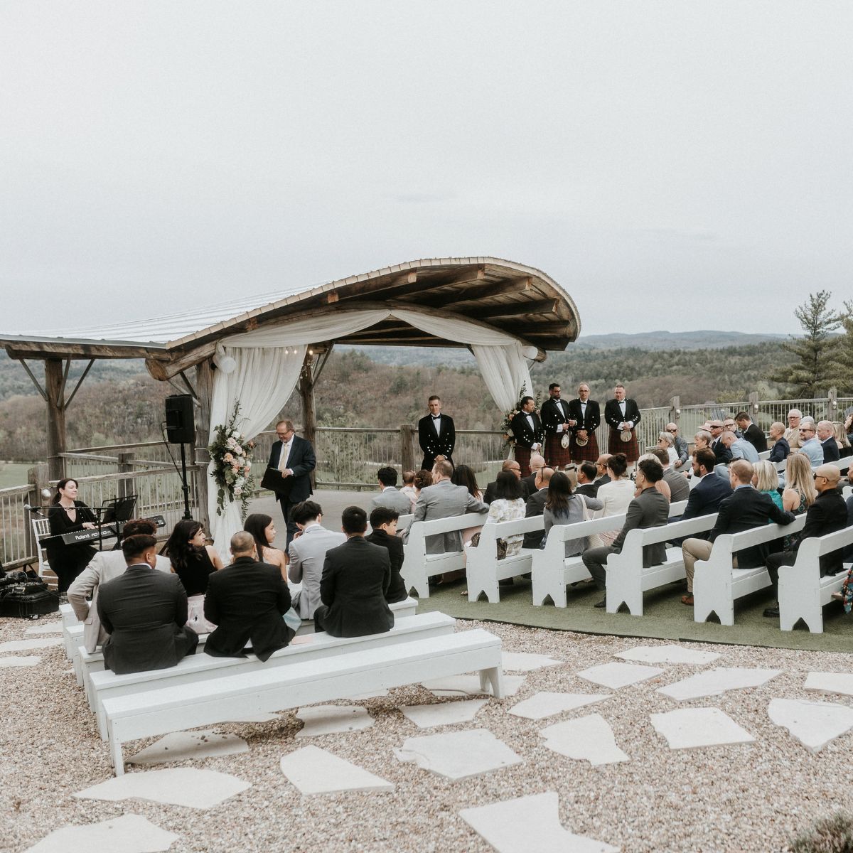 Outdoor cliffside wedding ceremony setup at Le Belvedere in Wakefield.