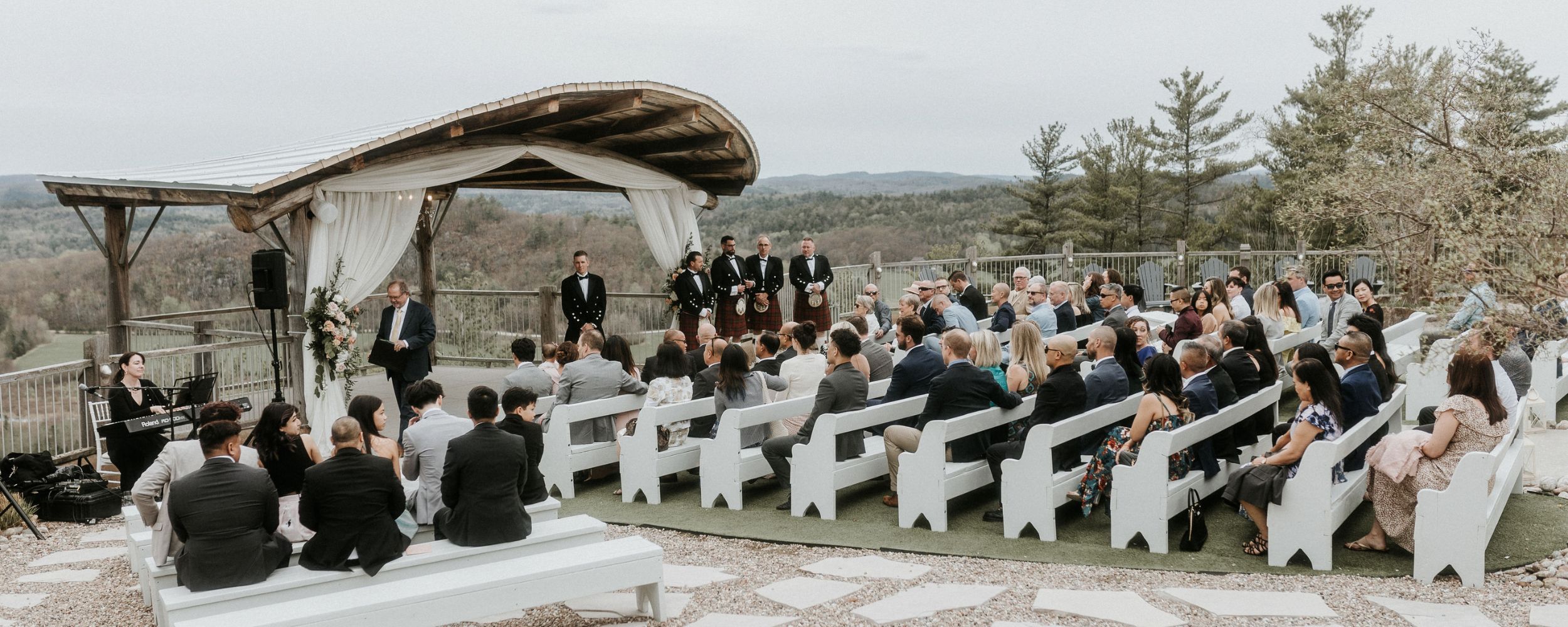 Outdoor cliffside wedding ceremony at Le Belvédère featuring live music by Kimberley Dunn