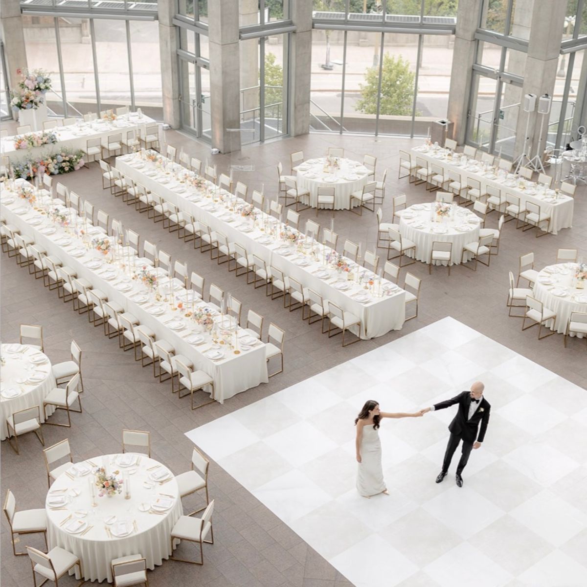 A couple dancing at their wedding reception in the National Gallery of Canada.