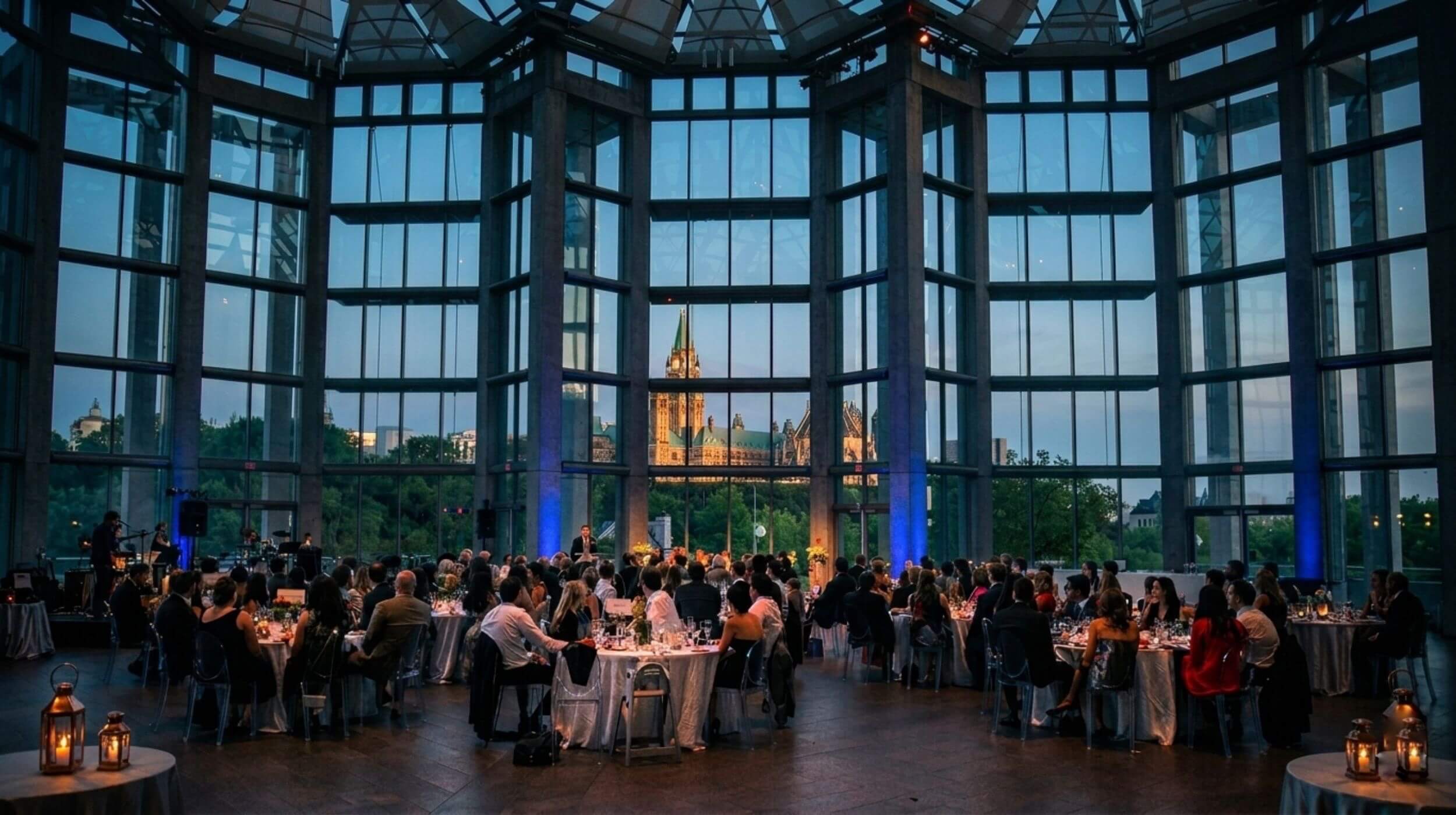 Wedding reception setup in the National Gallery of Canada's Great Hall with views of Parliament Hill.