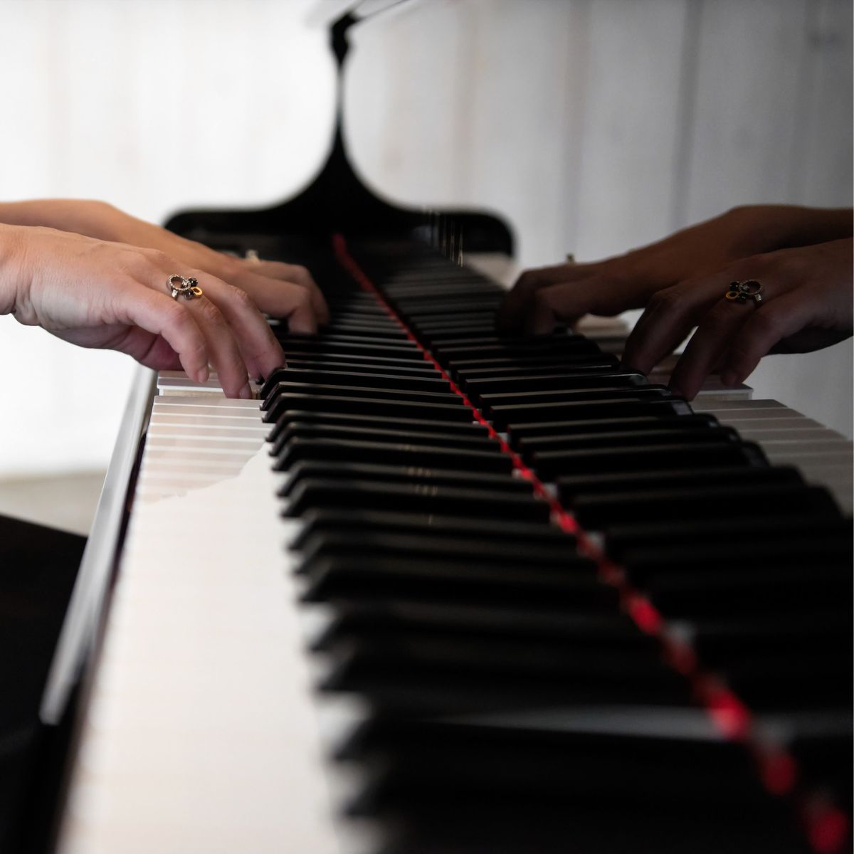 Kimberley Dunn playing at a grand piano at Stonefields Estate.