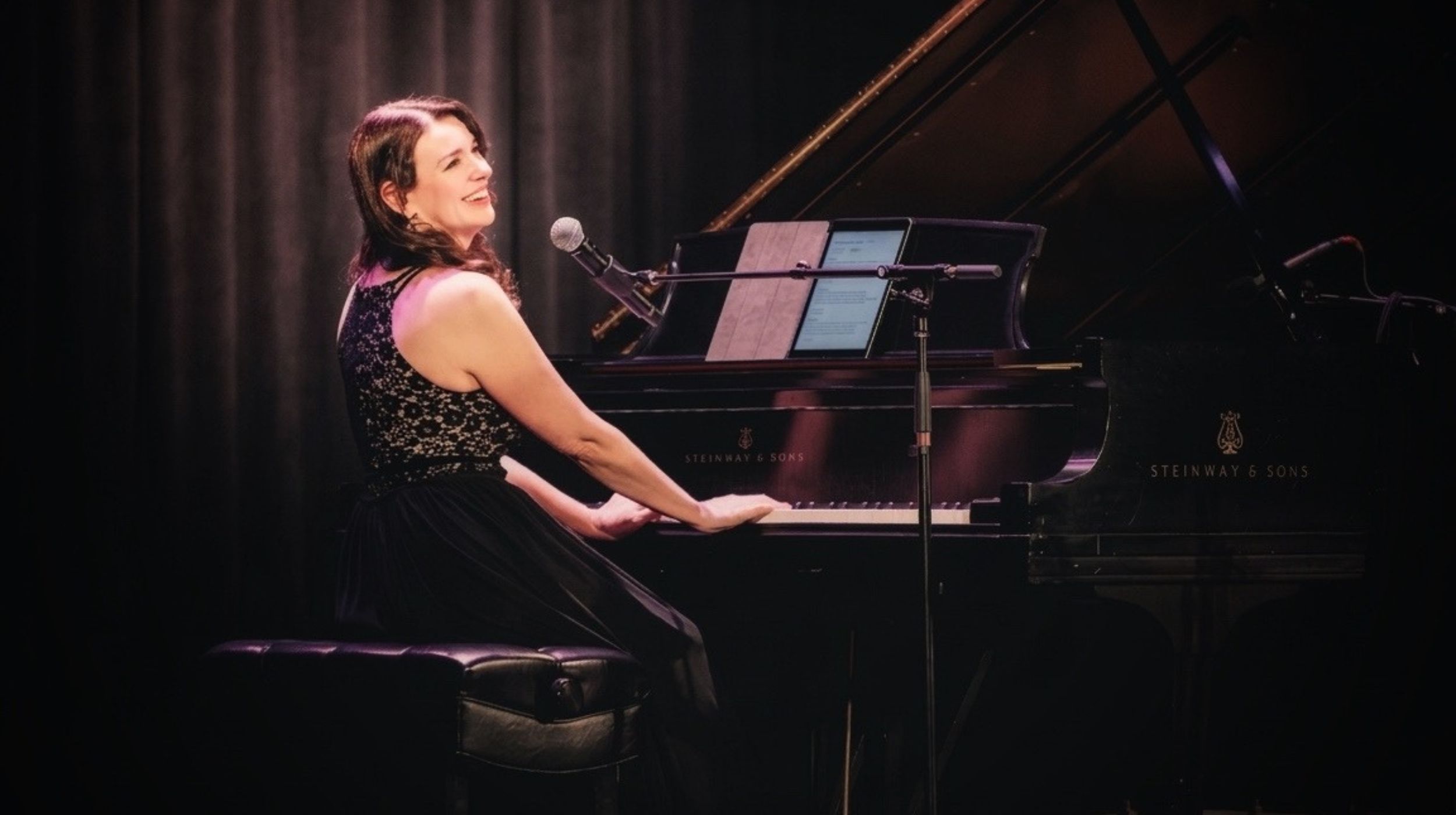 Kimberley Dunn performing at the Strong Auditorium in Rochester at the Dylan Cohen Tribute concert.
